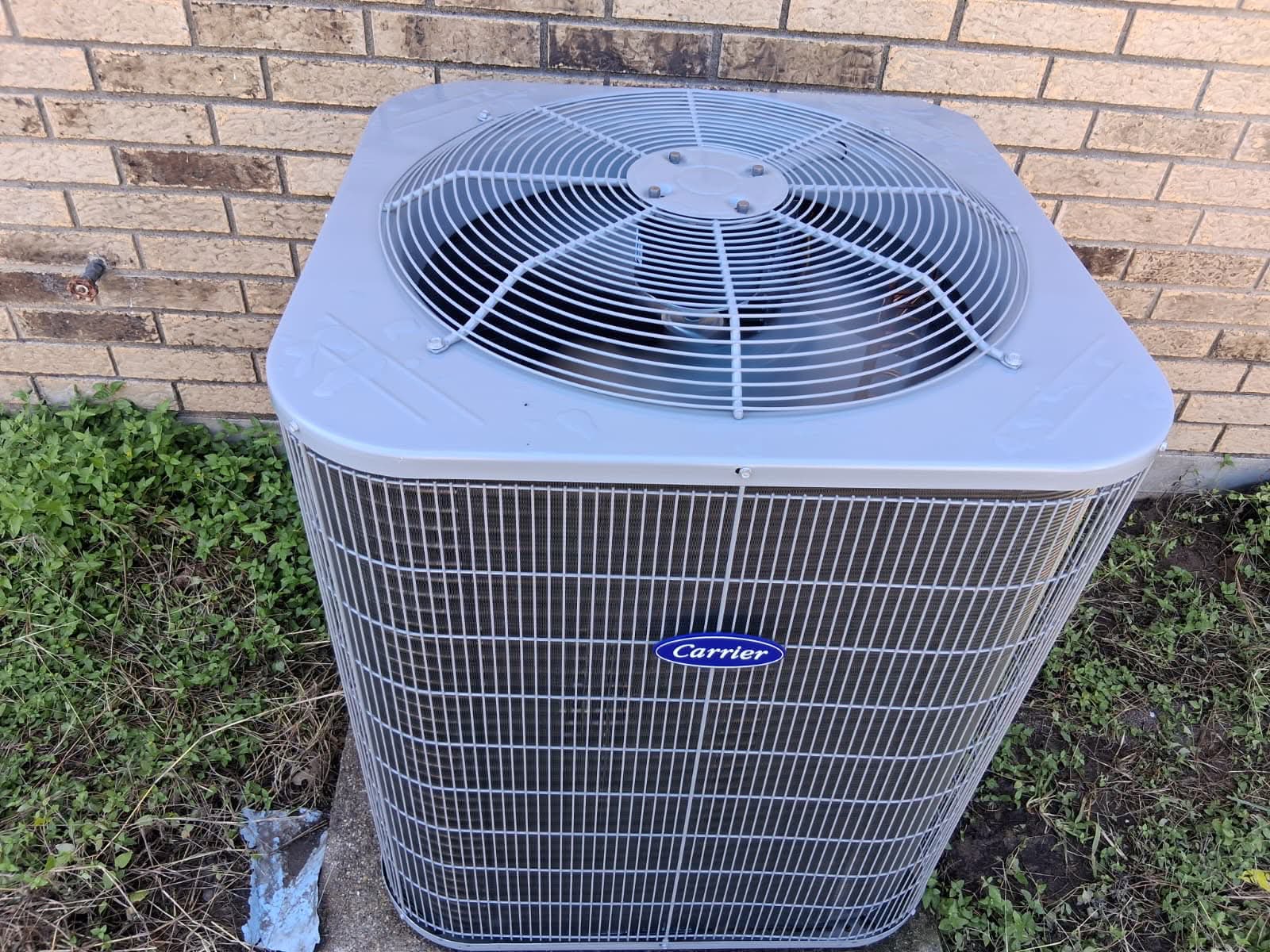 New Carrier air conditioning condenser installed during a Keyheart renovation project